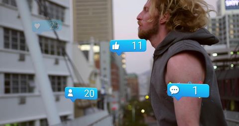 Man Engaged with Digital Media Notifications in Urban Cityscape