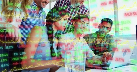 Diverse Team Analyzing Stock Market Data on a Laptop