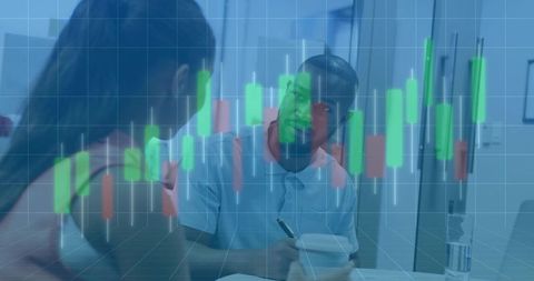 Coworkers Analyzing Financial Chart in Office Environment