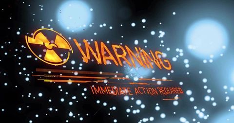 Flashing glowing orange radiation trefoil and warning text on futuristic hud alert display