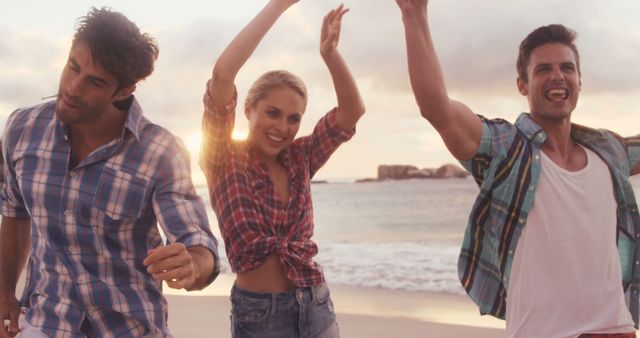 Friends Dancing and Laughing on Beach at Sunset - Download Free Stock Images Pikwizard.com