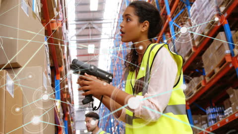 Warehouse Worker Using Scanner with Digital Communication Overlay