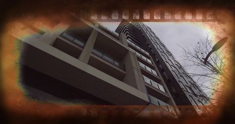 Low-angle towering high-rise with balconies, concrete bands and vintage film border