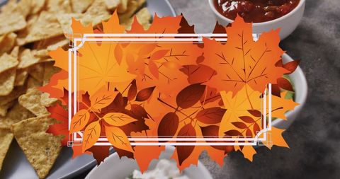 Autumn leaf frame with nachos and various dips