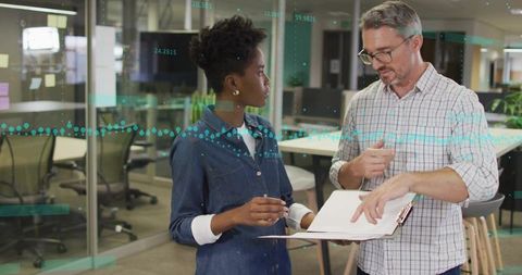 Modern Office Colleagues Discussing Data with Digital Graphs