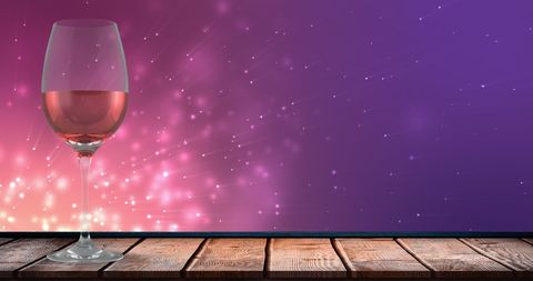 Rosé Wine Glass with Sparkling Light Background