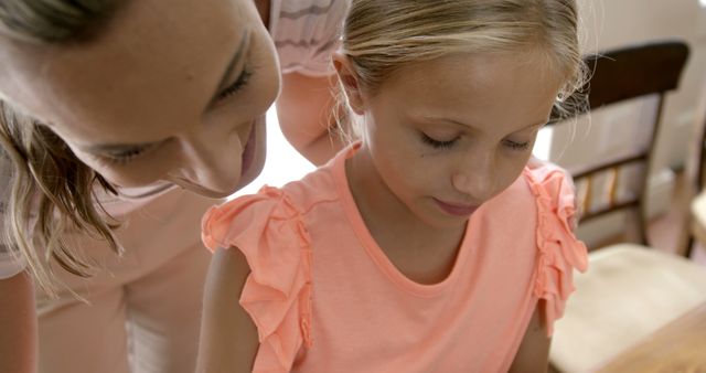 Mother Helping Daughter with Homework in Cozy Home - Download Free Stock Images Pikwizard.com