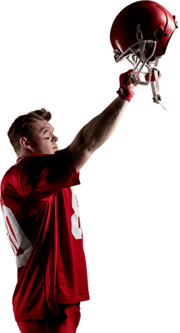 Young football player celebrating with helmet held high on transparent background