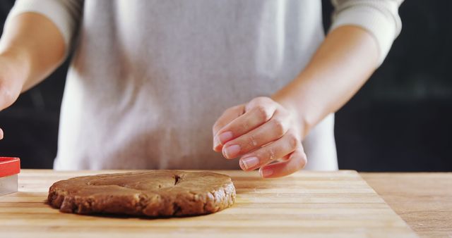 Person Preparing to Cut Cookie Dough On Wooden Surface - Download Free Stock Images Pikwizard.com