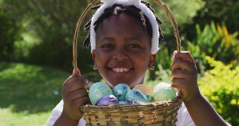 Joyful Girl with Easter Egg Basket in Sunny Garden