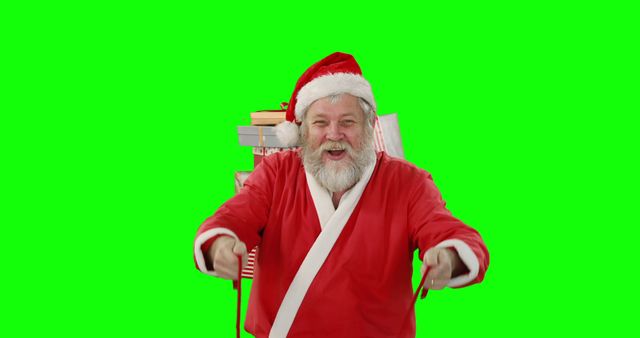 Jolly Santa Claus pointing and smiling in front of green screen - Download Free Stock Images Pikwizard.com