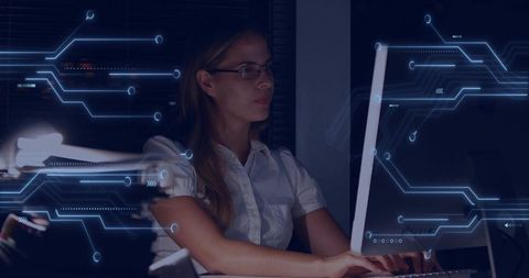 Businesswoman Analyzing Digital Circuit Technology on Computer at Night