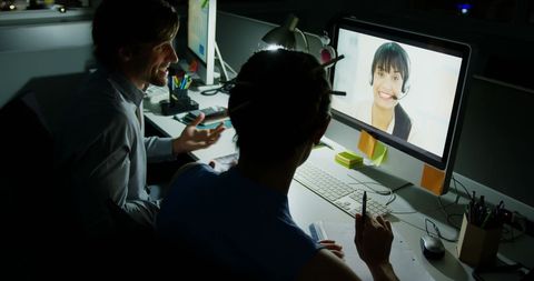 Office Professionals Engaged in Video Conference Call at Night - Download Free Stock Images Pikwizard.com
