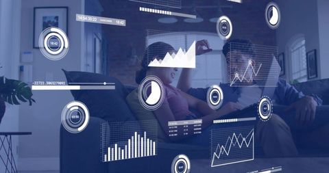 Couple on couch exploring augmented reality data dashboards while relaxing at home