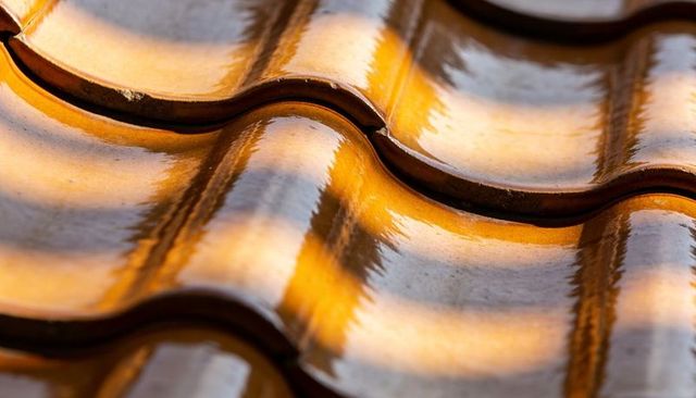 Glazed Ceramic Roof Tiles Reflecting Warm Sunlight, Glossy Amber Wave Pattern