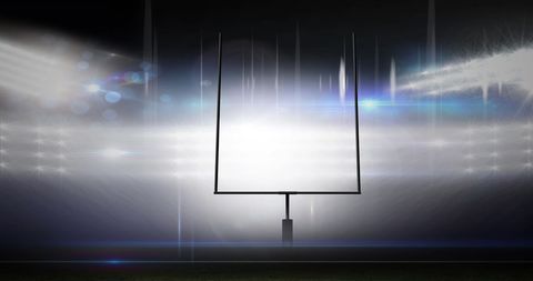 Dramatic American Football Goalposts Under Stadium Lights