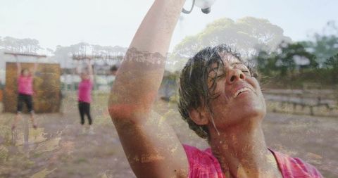 Woman Cooling Down After Outdoor Workout With Water Bottle