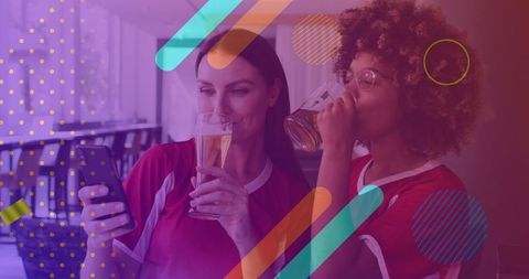 Smiling Friends Checking Scores on Phone During Sports Match