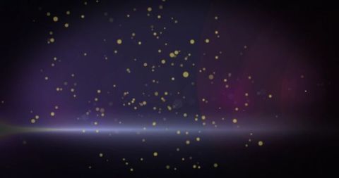 Shimmering golden bokeh drifting over purple studio backdrop with soft pale horizon flare