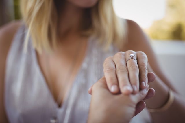 Close-Up of Engagement Ring on Woman's Hand - Download Free Stock Photos Pikwizard.com