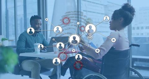 Collaborating team reviewing digital network and accessibility solutions in modern office