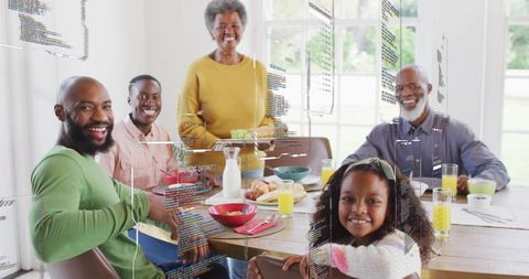Multi-generation family enjoying sunlit breakfast with augmented reality overlays at dining table