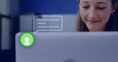 Teenage girl smiling while using laptop with chat overlay in cozy study nook