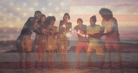 Diverse Friends Celebrating with Sparklers on Patriotic Beach Evening