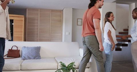 Friends Gathering at Home in Relaxed Living Room Setting