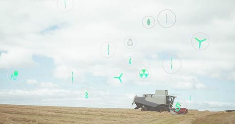 Digital Interface Icons Above Wheat Field with Harvesting Machinery