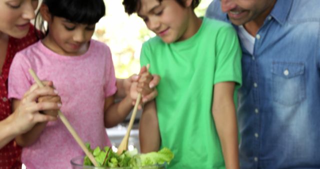 Family Making Salad Together in Kitchen - Download Free Stock Images Pikwizard.com