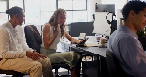 Innovative Team Collaborating Enthusiastically in Modern Office