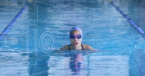 Asian Athlete Swimming in Pool with Futuristic Data Displays