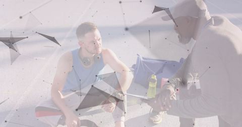 Trainer and Athlete Discussion with Geometric Overlay at Sports Stadium - Download Free Stock Images Pikwizard.com