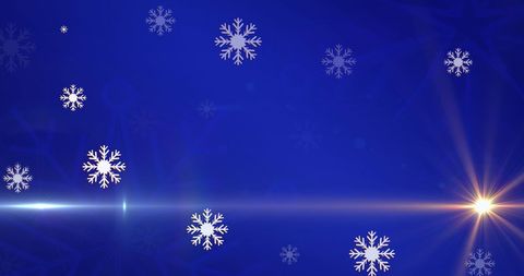 Falling Snowflakes and Glowing Light on Blue Background
