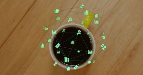 Overhead View of Coffee Mug with Digital Financial Icons Concept