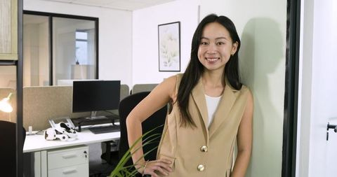 Confident Asian Professional Woman in Modern Office Environment