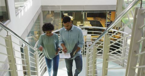 Business Professionals Collaborating While Ascending Office Staircase - Download Free Stock Images Pikwizard.com