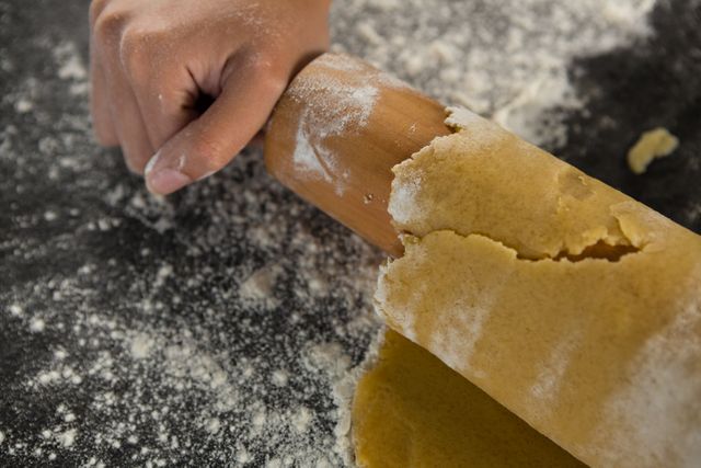 Close-up of Hand Rolling Dough with Rolling Pin - Download Free Stock Photos Pikwizard.com