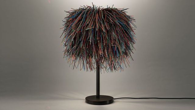 Colorful shaggy table lamp with multicolor fiber shade on sleek black base modern accent