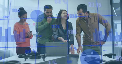 Diverse Business Team Analyzing Financial Data Projection in Office