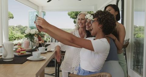 Diverse Group of Women Enjoying Outdoor Wedding Reception