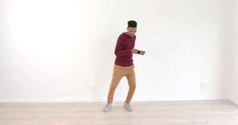 Man Dancing Happily in Minimalist Bright Room