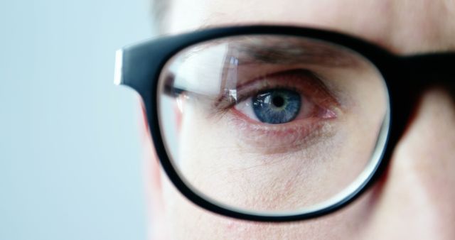 Close-up of Person Wearing Black Frame Glasses - Download Free Stock Images Pikwizard.com