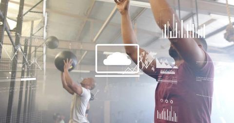 Group medicine ball training with cloud analytics overlay and performance charts in industrial gym