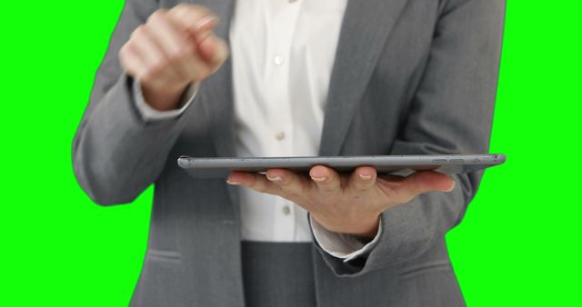 Businessperson Using Tablet in Professional Setting on Green Screen - Download Free Stock Images Pikwizard.com