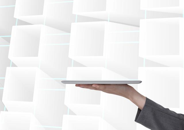 Business professional holding tablet against a futuristic holographic background with floating cubes. Ideal for illustrating technology concepts, innovation, business presentations, digital interfaces, and modern communication visuals.