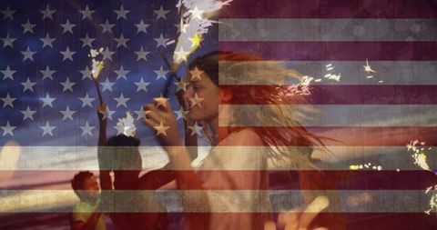 Celebratory Beach Party with Sparklers and American Flag
