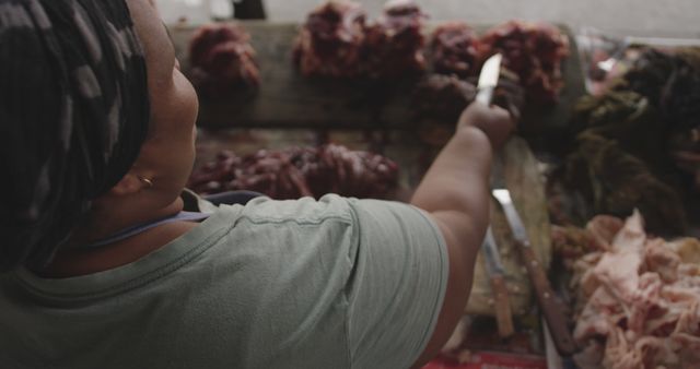 Butcher Woman Skillfully Slices Meat in Local Butcher Shop - Download Free Stock Images Pikwizard.com