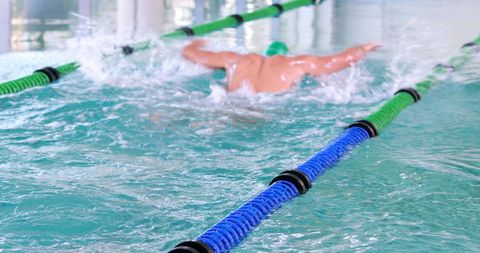Athletic Swimmer Performing Powerful Butterfly Stroke - Download Free Stock Images Pikwizard.com